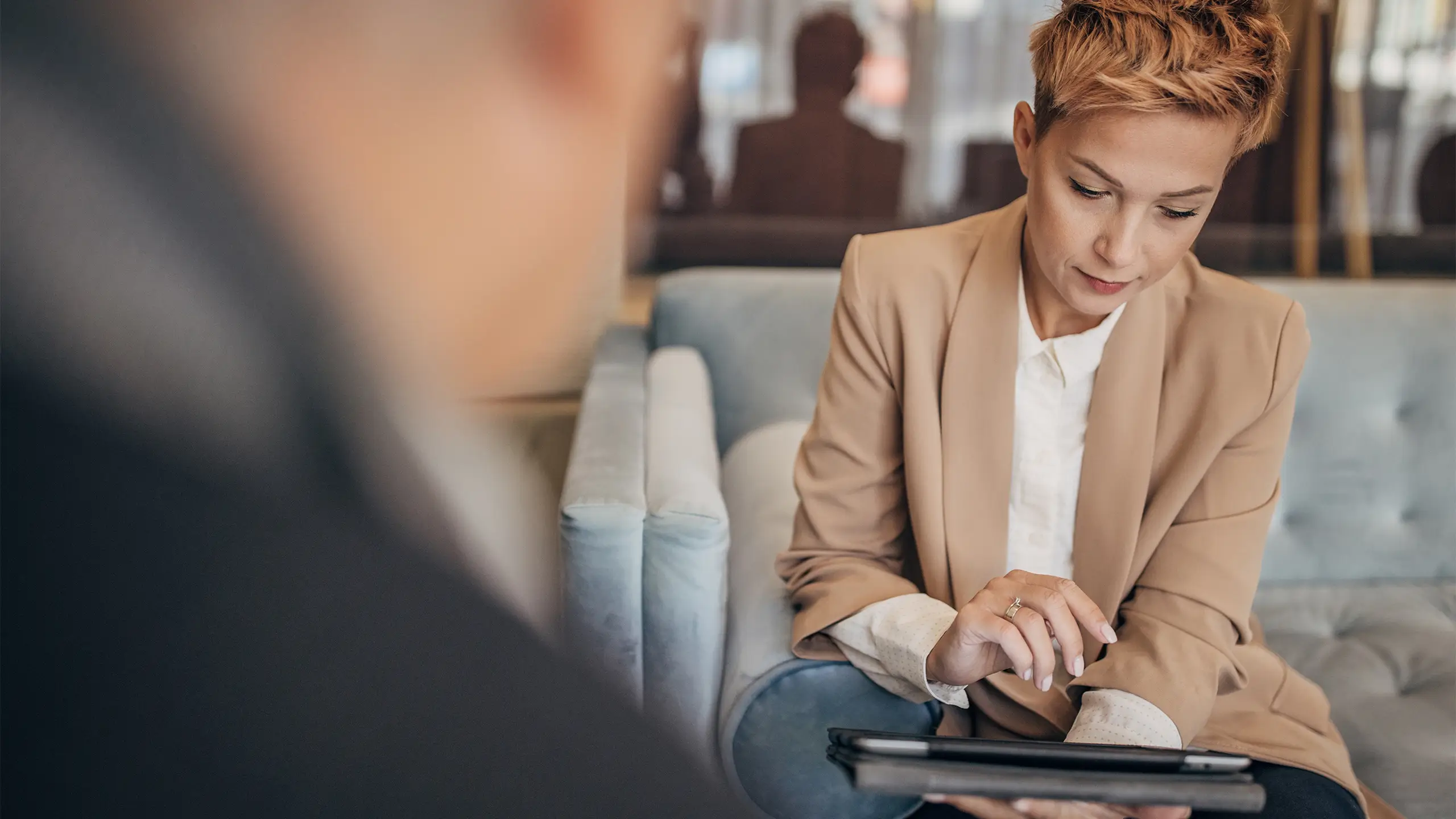 Father and daughter talking about business in luxury hotel