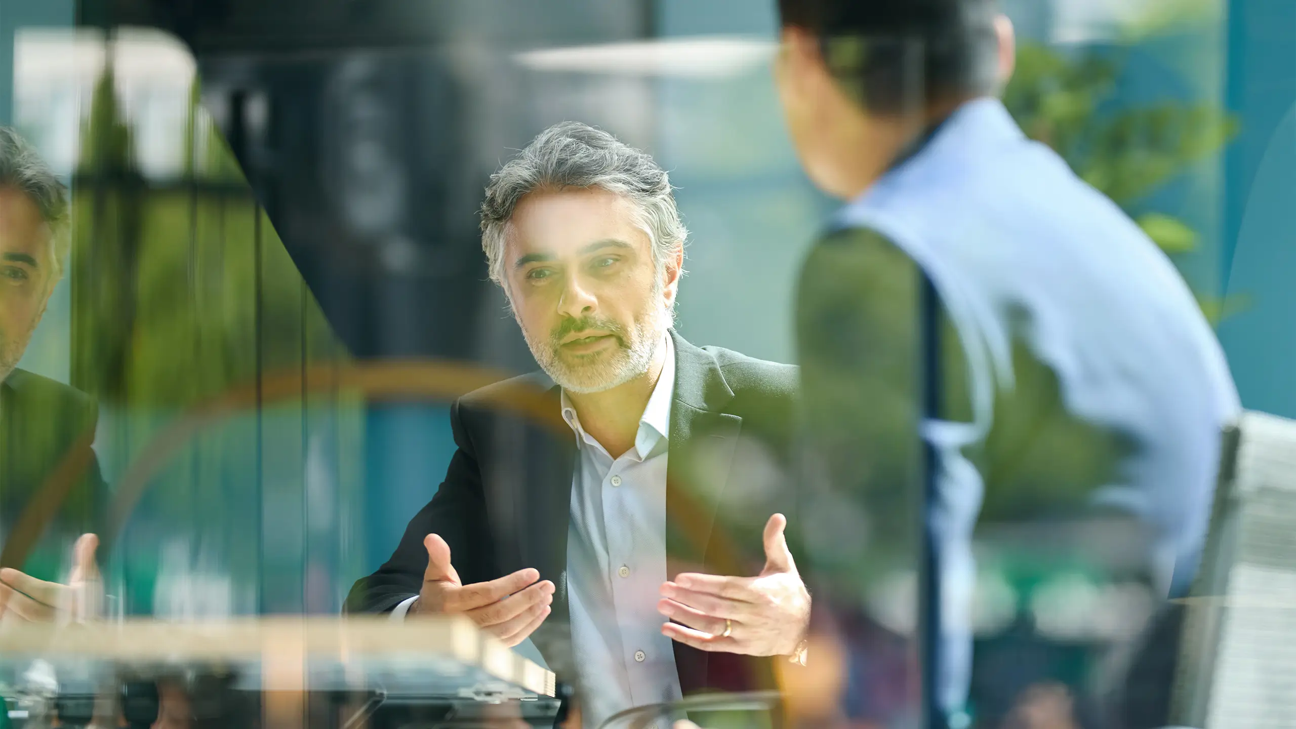 Medium shot of businessman discussing project with colleague
